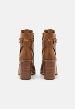 MICHAEL Michael Kors Darcy Heeled - Ankle Boots - Brown -Stride Shop 0e169c02dc4b425681be4dbe4d9223eb