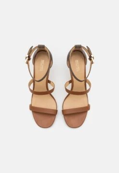 MICHAEL Michael Kors Koda- Sandals - Brown -Stride Shop 21065703ff2a489f88e926e790f712a4