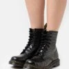Dr. Martens 1460 - Lace-Up Ankle Boots 1 Dr. Martens 1460 - Lace-Up Ankle Boots -Stride Shop 91106a2e33d24567bc8300d6ada2f10b