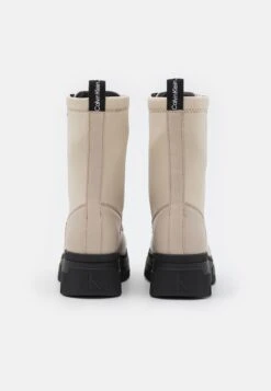 Calvin Klein Jeans Chunky Combat Laceup Zip - Platform Ankle Boots - Eggshell -Stride Shop aa5655a8f77843bd9d07bcc8a81ca569