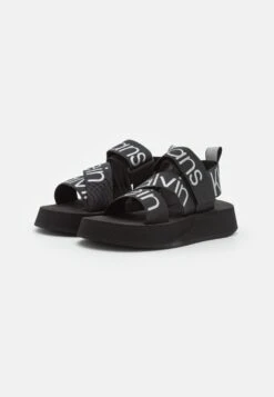 Calvin Klein Jeans Prefersato - Platform Sandals - Black/Reflective Silver -Stride Shop ce5f238df4b14c0f87526faf8c390829
