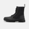 Dr. Martens Combs Ii Unisex - Lace-Up Ankle Boots - Black -Stride Shop f8e45c4ebedc464d81dd3a699d82af75