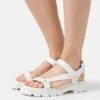 MICHAEL Michael Kors Ridley - Sandals - Optic White -Stride Shop fefd022275bf44608fe8fc29eec5a7ad
